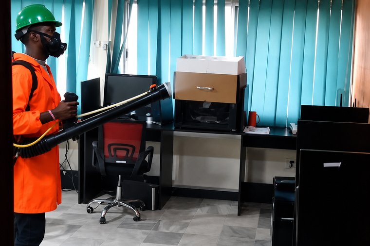 Technician fumigating an office space